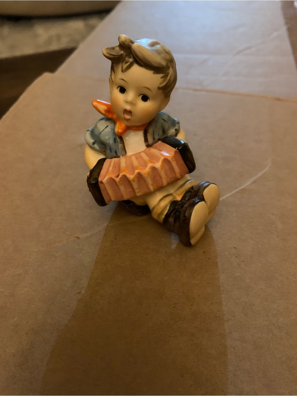 Hummel Boy Figurine with Blue Jacket and Orange Scarf
